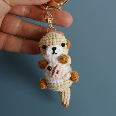 Mua Dệt Amigurumi Cute Plush Otter Holding Fish Keychain Oyuncak Crochet Động vật đồ chơi búp bê Soft Crocheted Otter Keychains sản xuất trực tuyến